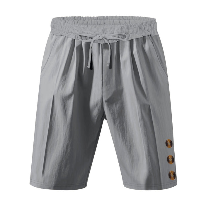 Men's knee-length casual Bermuda shorts with elastic tunnel drawstring waist, side slit pockets, and round decorative appliqués StylebySassy