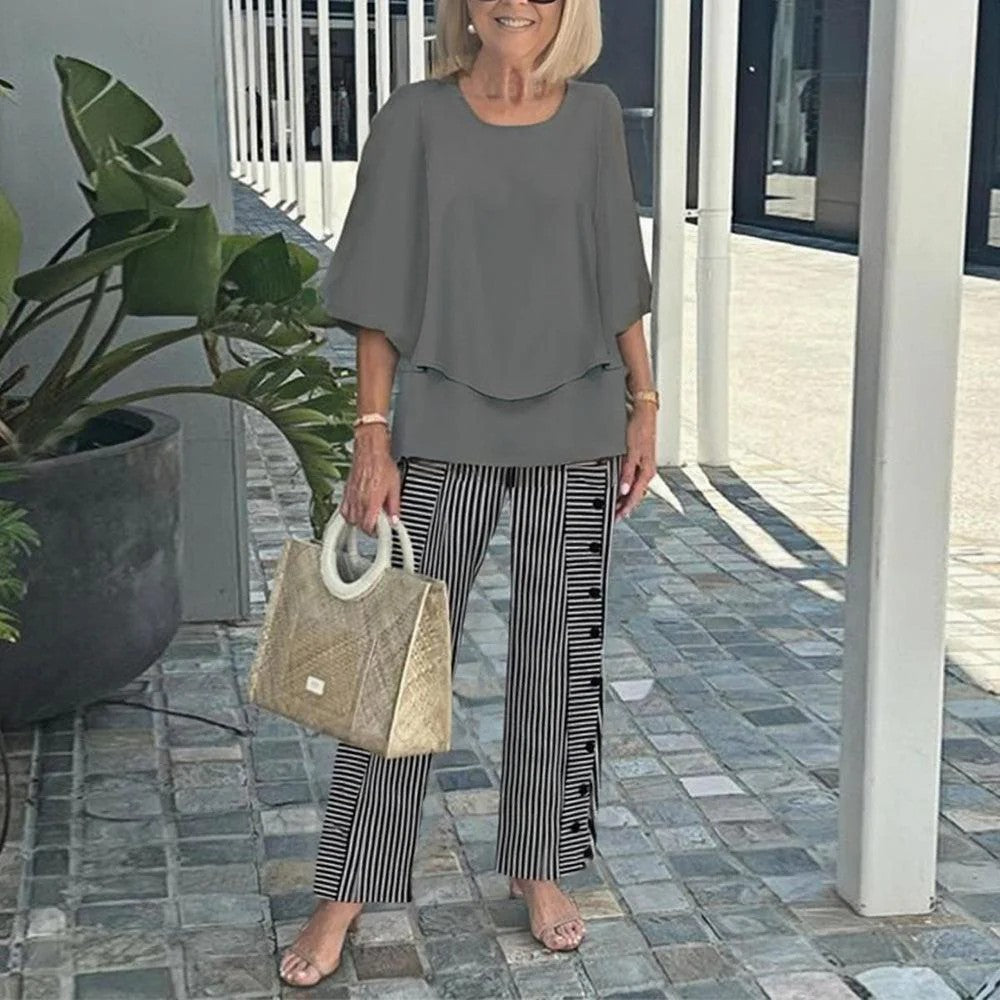 Women's layered tunic with cape sleeves and ankle-length straight leg pants with graphic print StylebySassy