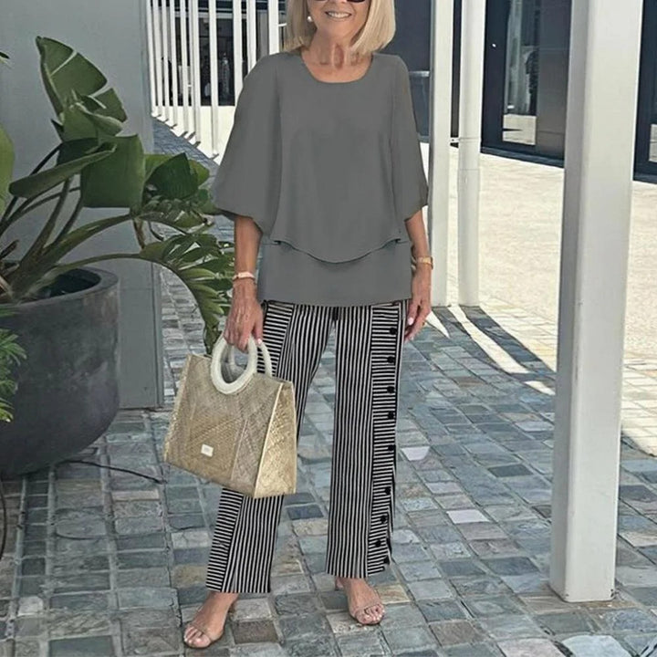 Women's layered tunic with cape sleeves and ankle-length straight leg pants with graphic print StylebySassy