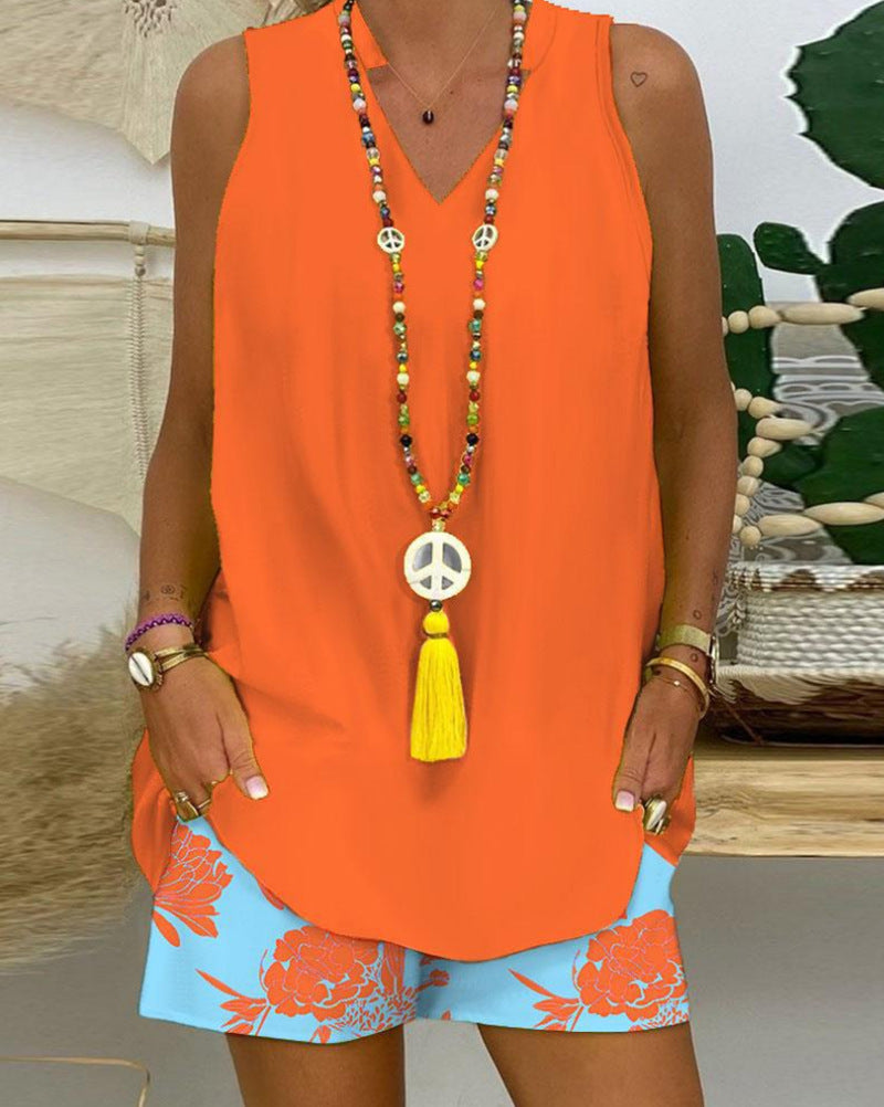 Women's sleeveless V-neck long top with curved hem and side insertion pockets StylebySassy