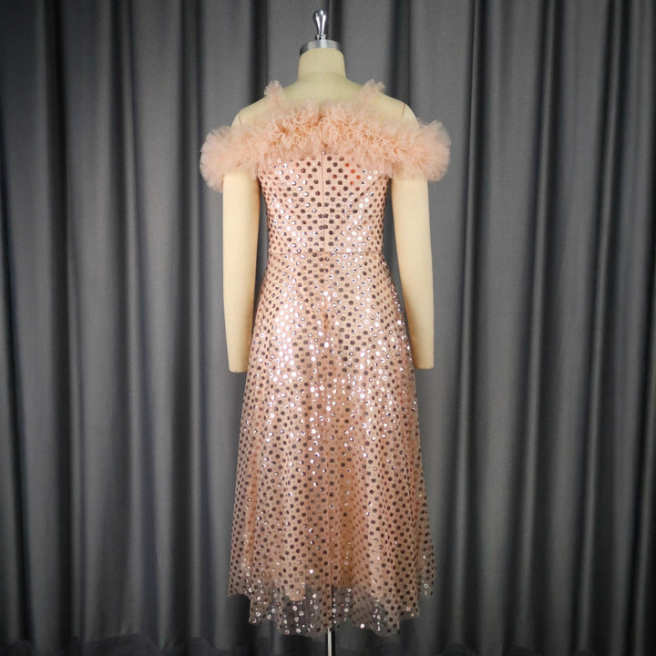 Women’s festive evening dress with voluminous ruffle details and delicate glitter StylebySassy