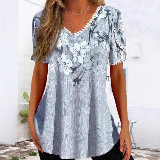 Women's nan legeres V-neck tunic shirt with floral pattern and pompom trim StylebySassy