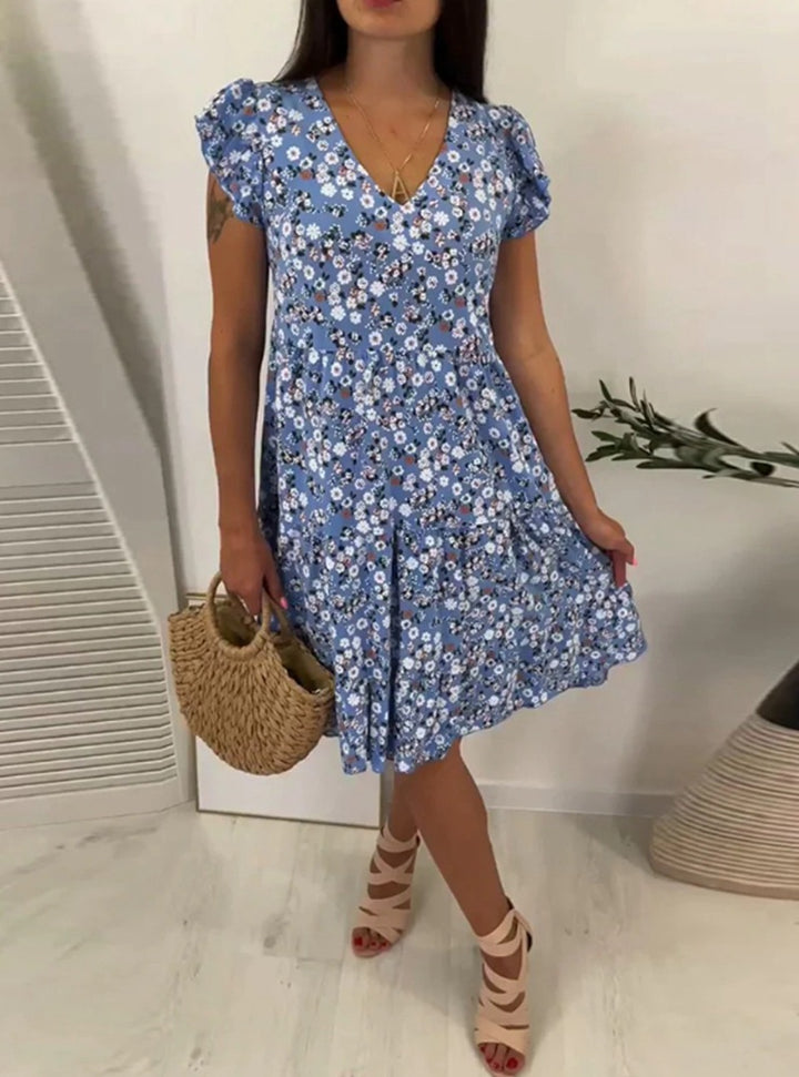 Ladies' V-neck tiered dress with puff sleeves and fitted underbust seam StylebySassy