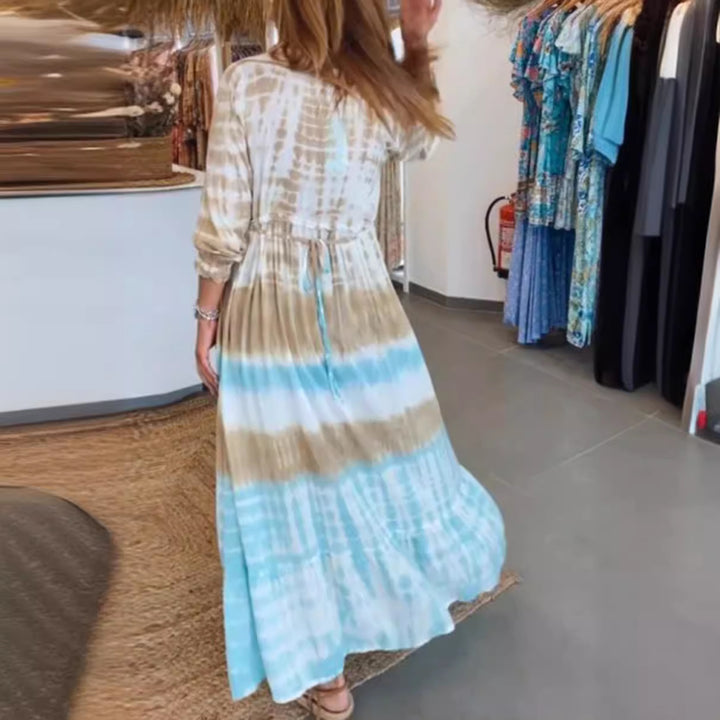 Women's airy batik tiered dress with V-neck, empire waist, and elastic sleeves StylebySassy