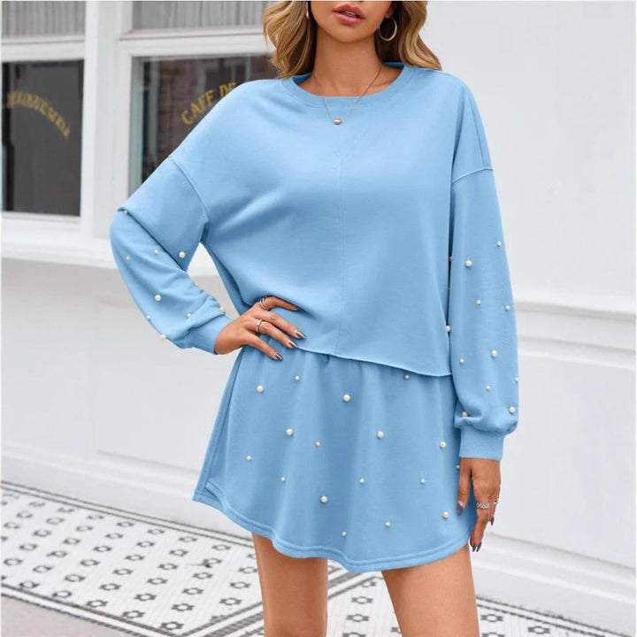 Ladies nan pearl-embellished sweat set with oversized sweater and flared mini skirt StylebySassy
