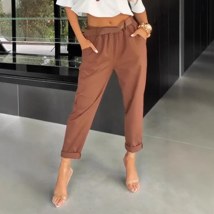 Women's high-waisted paperbag pants with gathered waistband, side pockets, and rolled hem StylebySassy
