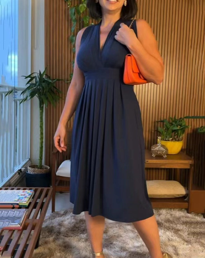 Women's sleeveless V-neck midi dress with underbust seam and flattering pleated skirt StylebySassy