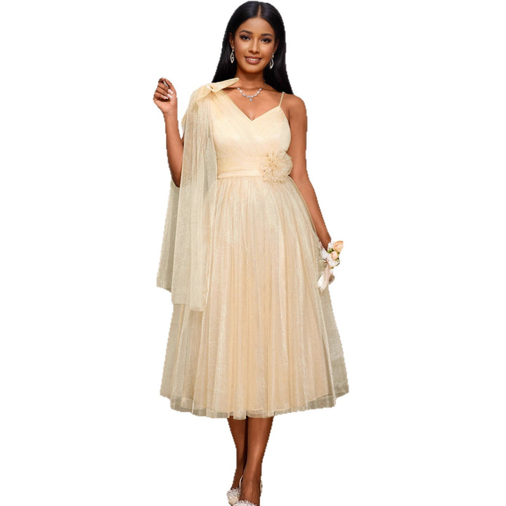 Women's glamorous cocktail dress with voluminous overlay and floral accents StylebySassy