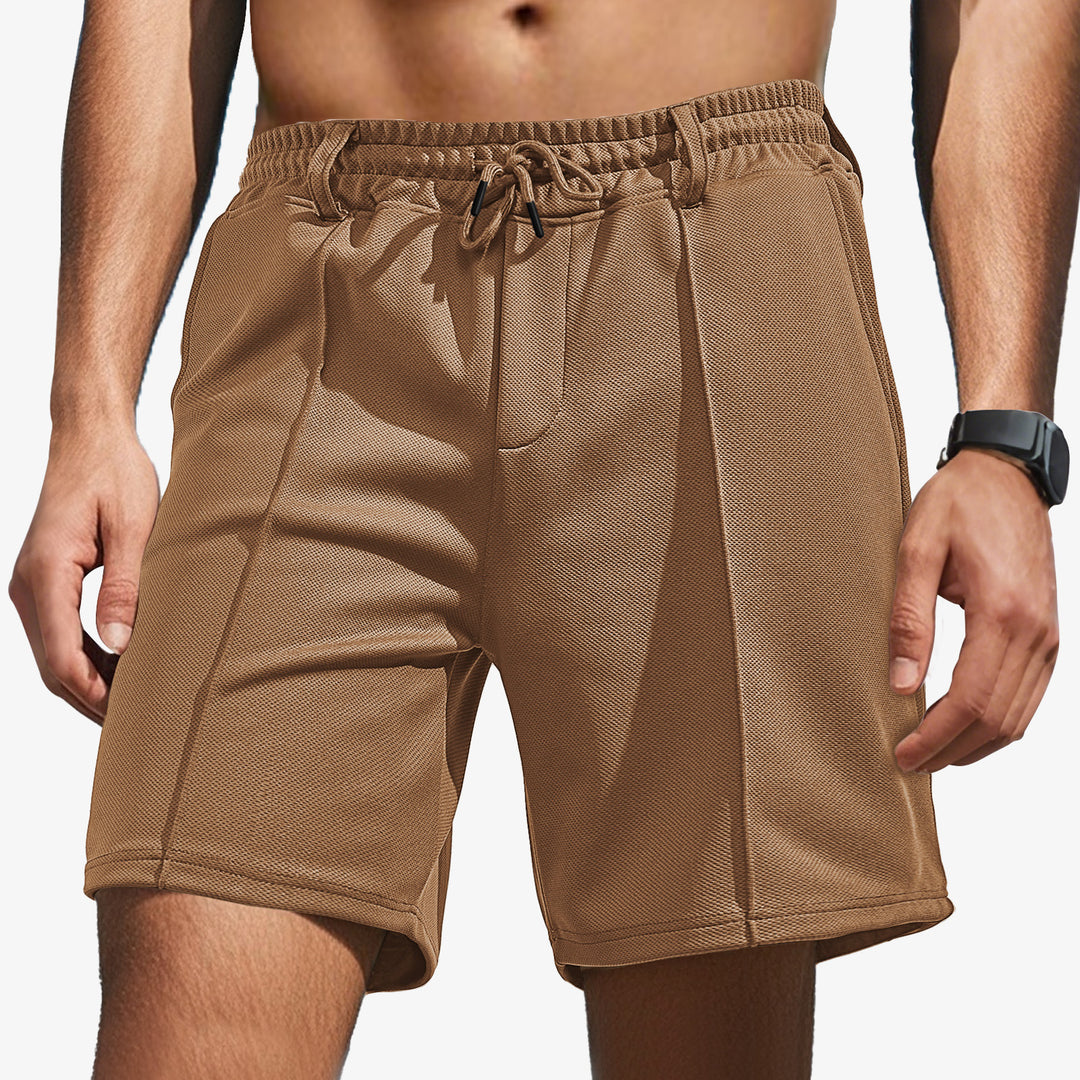 Men's knee-length sports shorts with mesh structure, elastic drawstring, and belt loops StylebySassy
