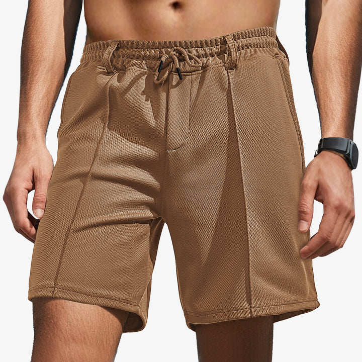 Men's knee-length sports shorts with mesh structure, elastic drawstring, and belt loops StylebySassy