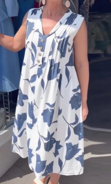 Women’s casual V-neck midi dress with bust yoke, vertical pleats, and decorative button placket StylebySassy