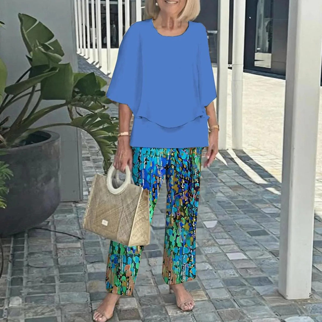 Women's layered tunic with cape sleeves and ankle-length straight leg pants with graphic print StylebySassy