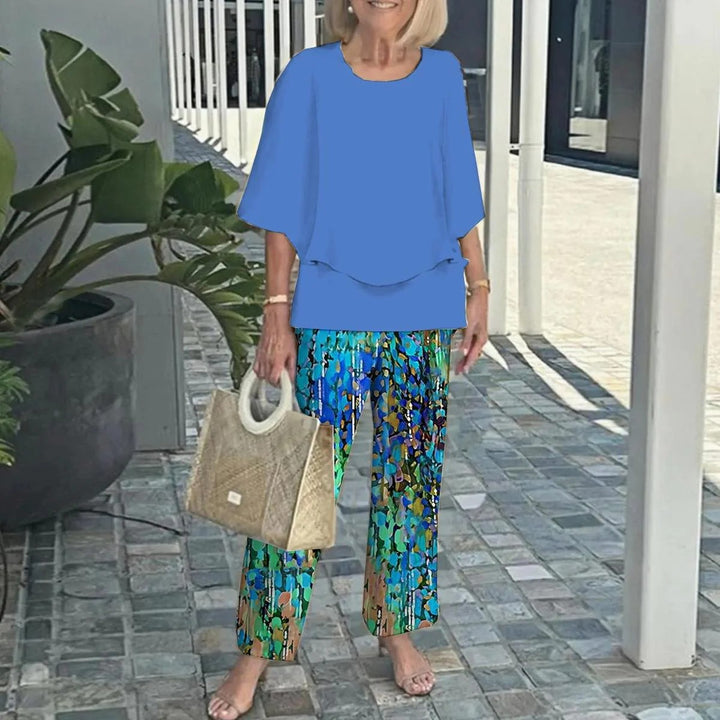 Women's layered tunic with cape sleeves and ankle-length straight leg pants with graphic print StylebySassy