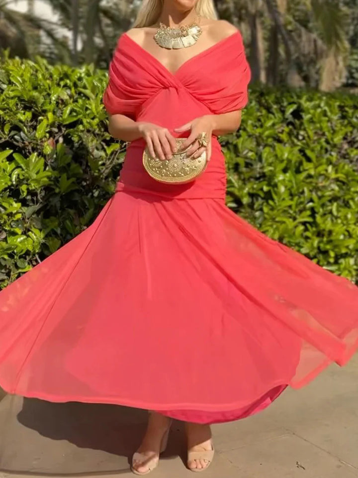 Ladies elegant floor-length evening dress with draped shoulder area and airy chiffon skirt StylebySassy