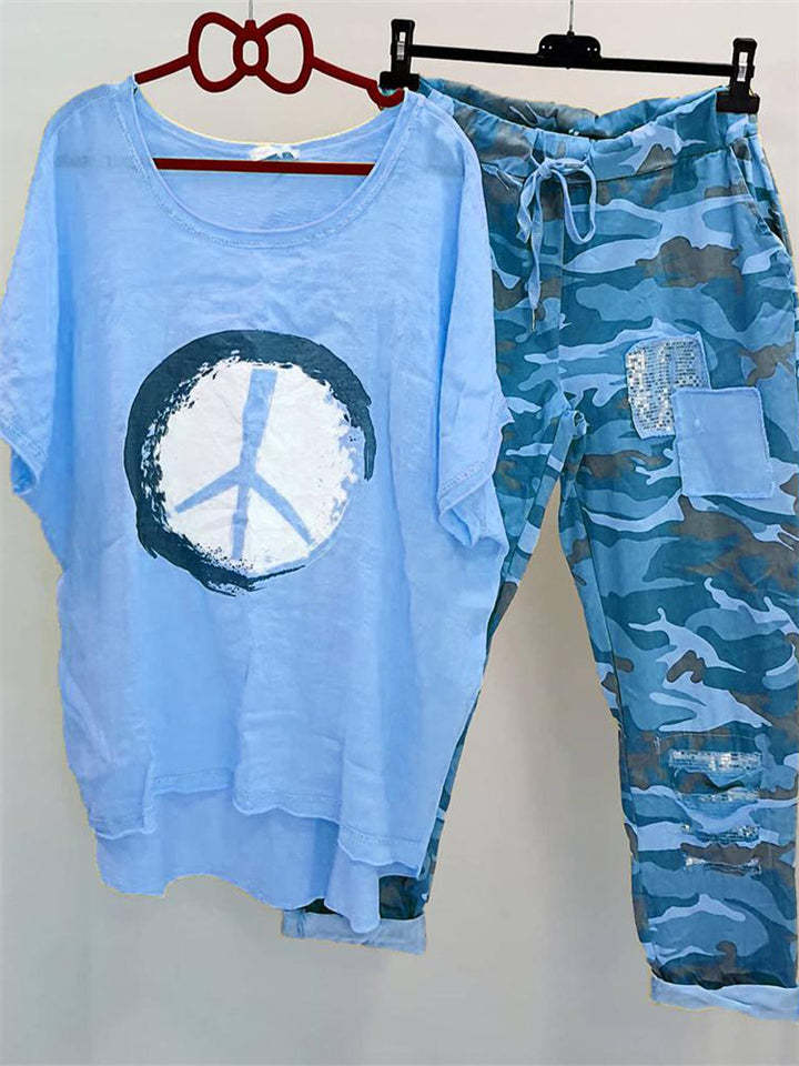 Women’s casual leisure two-piece with wide-cut linen look shirt, peace symbol and camouflage jog pants with patch details StylebySassy