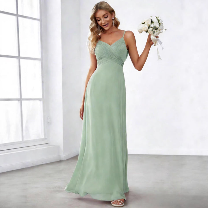 Ladies flowing chiffon evening dress with crossed draping, empire waist and fine spaghetti straps StylebySassy