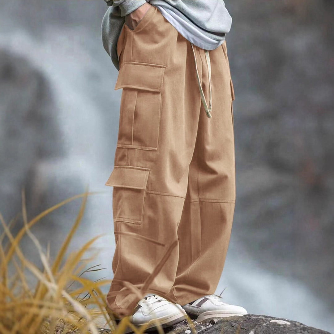 Men's casually cut multiple pockets cargo pants with wide leg and prominent knee darts StylebySassy