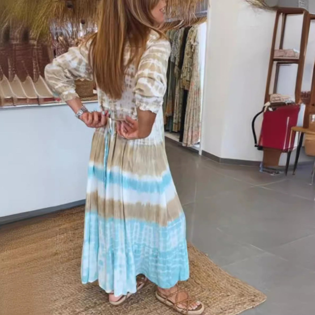 Women's airy batik tiered dress with V-neck, empire waist, and elastic sleeves StylebySassy