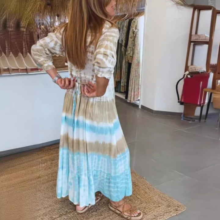 Women's airy batik tiered dress with V-neck, empire waist, and elastic sleeves StylebySassy