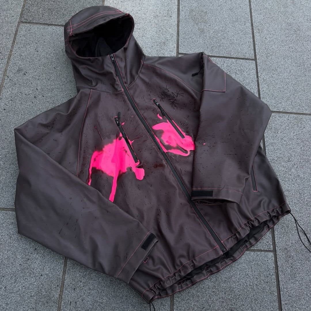 Unisex nan technical rain jacket with welded seams, slanted chest zip pockets, and adjustable drawstring hem StylebySassy