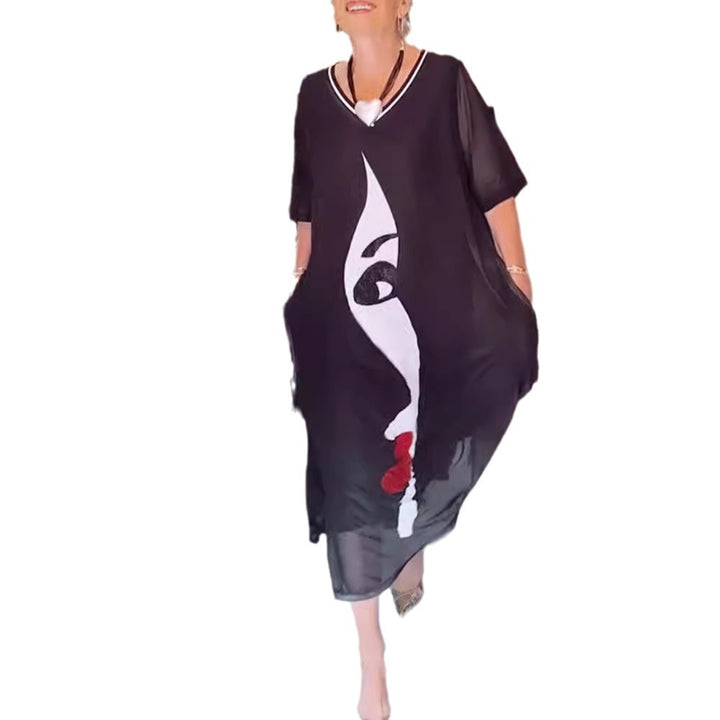Women's airy chiffon maxi dress with graphic face print, V-neck and side pockets StylebySassy