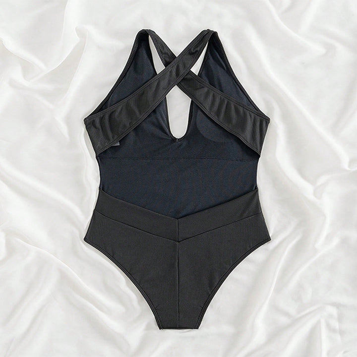Women's one-piece swimsuit with deep V-neckline and intricate ribbed details StylebySassy