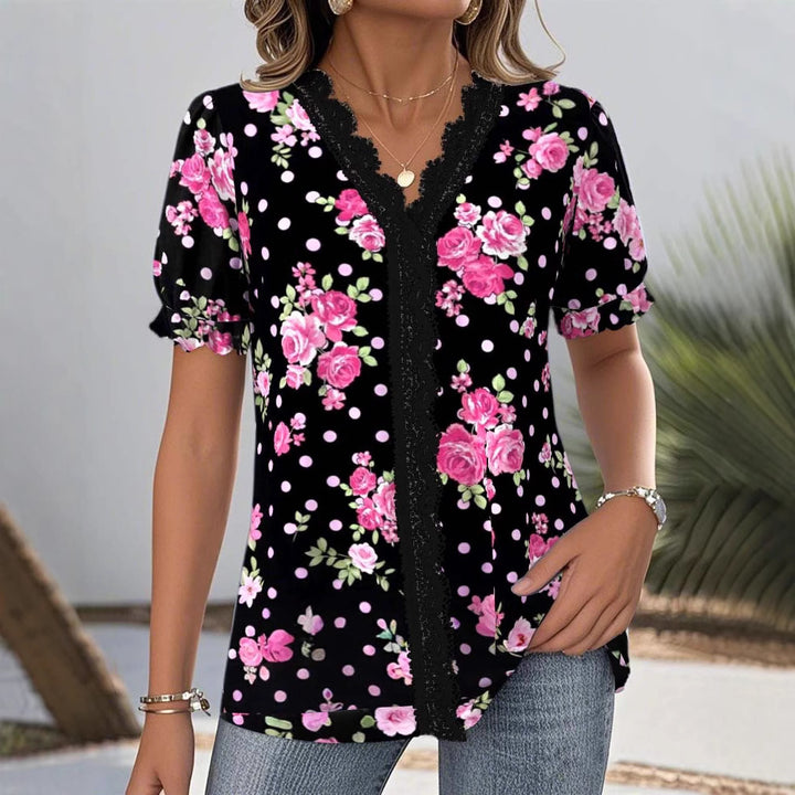 Ladies floral V-neck blouse with decorative lace trim and gathered short sleeves StylebySassy