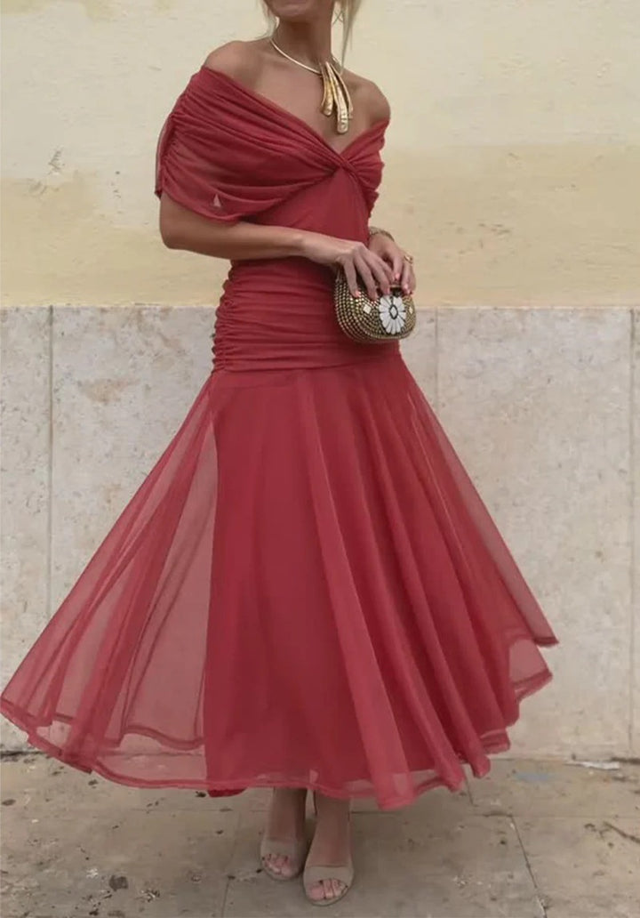 Ladies elegant floor-length evening dress with draped shoulder area and airy chiffon skirt StylebySassy