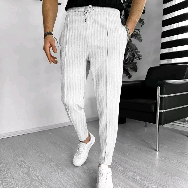 Men's tapered jogging chinos made of structured woven quality with elastic drawstring waistband and decorative crease StylebySassy