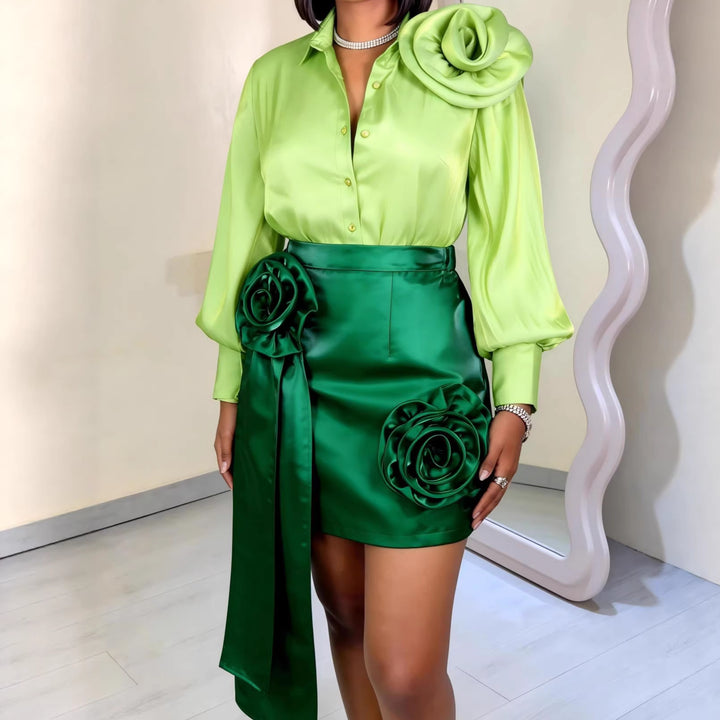 Women’s satin skirt with floral ruffle design and fitted bow detail.
