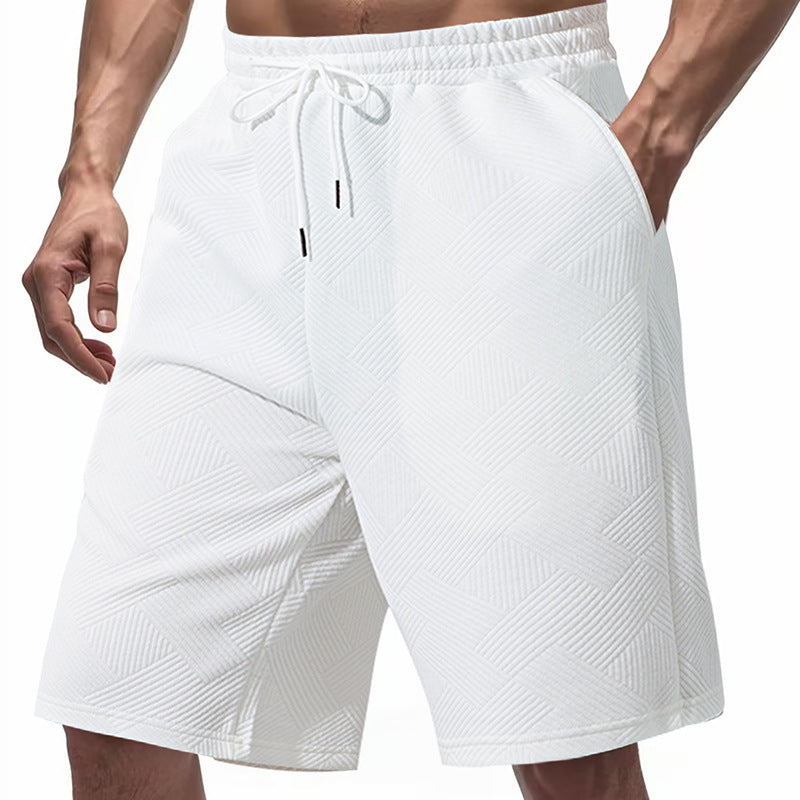 Men's knee-length textured swim shorts with elastic drawstring waistband and side pockets StylebySassy