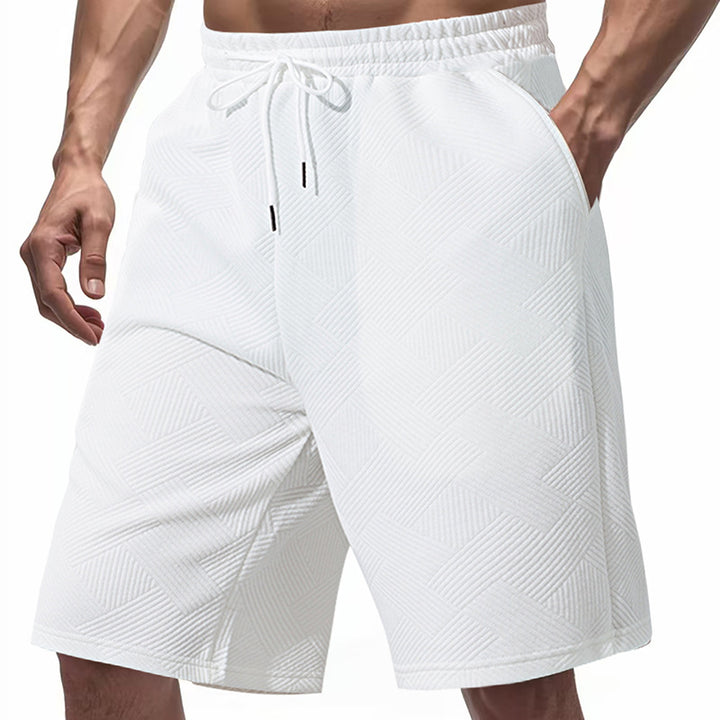 Men's knee-length textured swim shorts with elastic drawstring waistband and side pockets StylebySassy