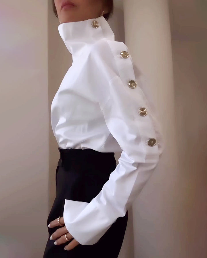 Women high-neck blouse with decorative shoulder buttons and flared cuffs StylebySassy