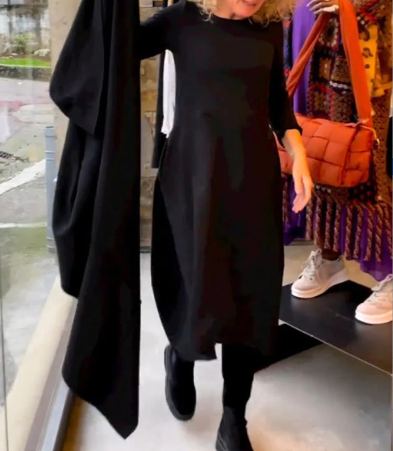 Women's asymmetrical balloon dress with three-quarter sleeves, side pockets, and flowing pointed hem StylebySassy