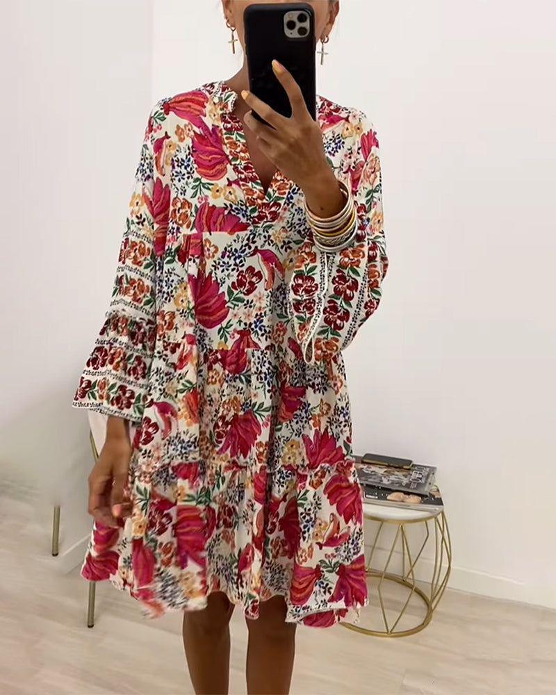 Women playful tunic tiered dress with deep V-neck, ruched bodice, ruffled tiers and ornamental embroidery trim StylebySassy