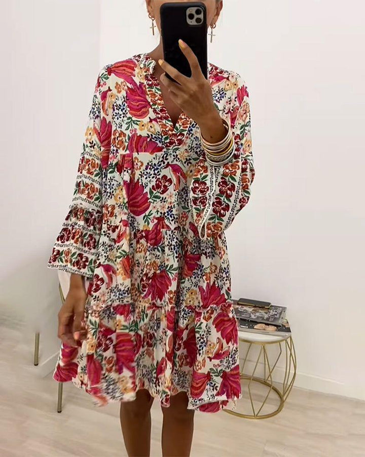 Women playful tunic tiered dress with deep V-neck, ruched bodice, ruffled tiers and ornamental embroidery trim StylebySassy
