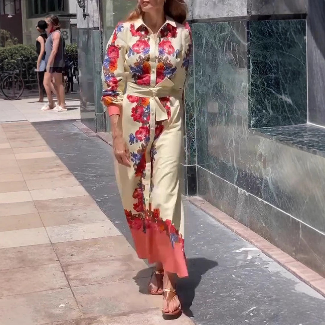 Women's long hem blouse dress with floral print, tie belt, and ruffle trim StylebySassy