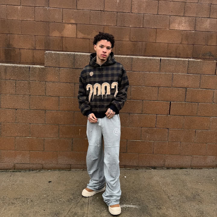 Unisex nan checkered hoodie with frayed year application and ribbed cuffs StylebySassy