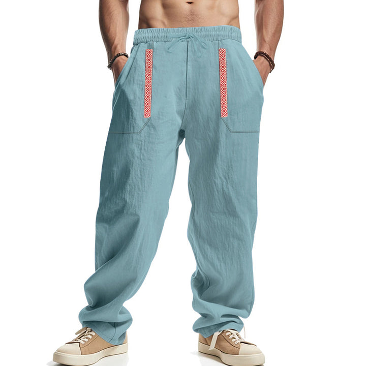 Men's loose-fitting casual pants made of linen blend with elastic waistband, deep side pockets, and ethnic decorative band StylebySassy