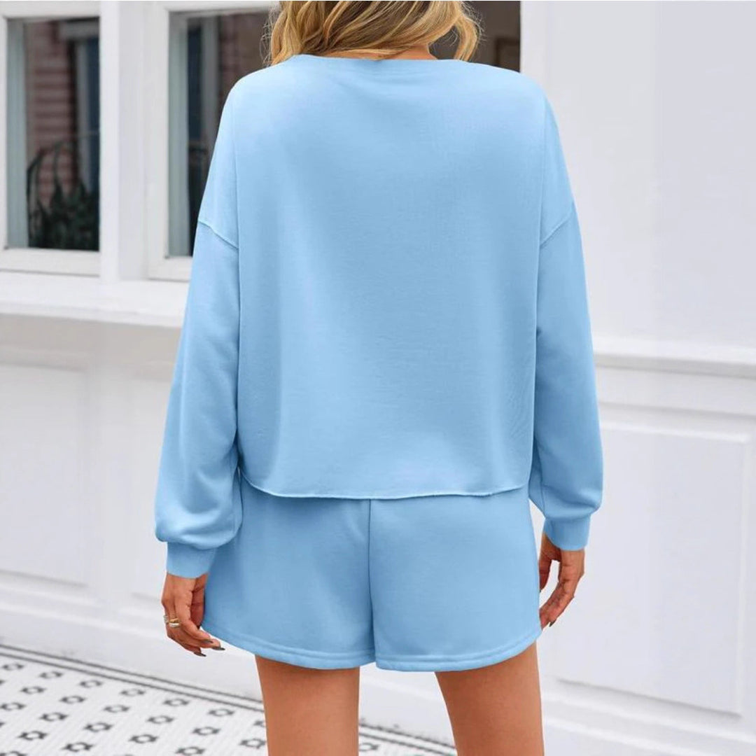 Ladies nan pearl-embellished sweat set with oversized sweater and flared mini skirt StylebySassy