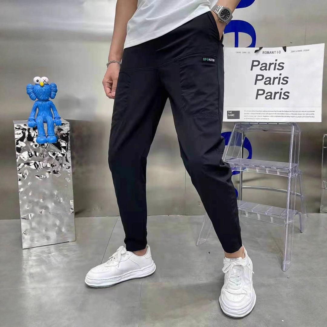 Men's sporty cargo jogger pants with elastic waistband, drawstring, and tapered leg hem StylebySassy