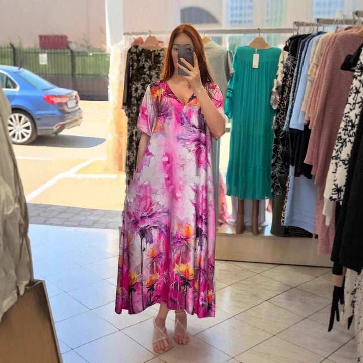 Women flowing maxi kaftan dress with V-neck and large watercolor floral print StylebySassy