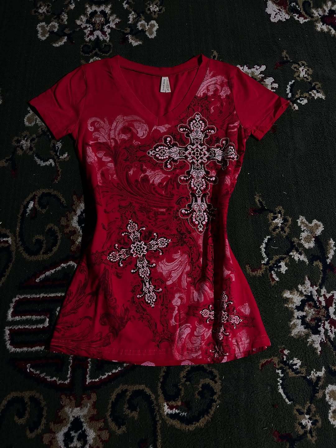 Women's T-shirt with decorative cross design and floral accents StylebySassy