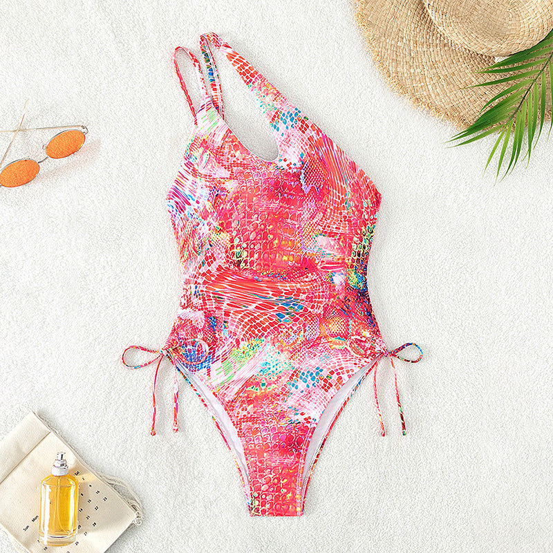 Women's one-sided swimsuit with sophisticated cut-out and vibrant pattern StylebySassy