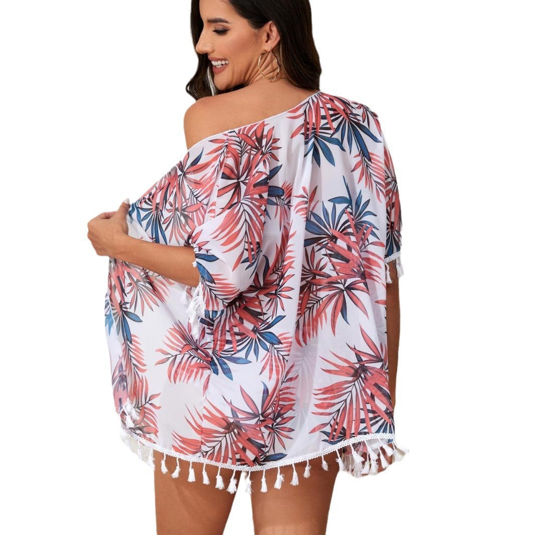 Ladies elegant beach outfit with floral cover-up and matching bikini StylebySassy