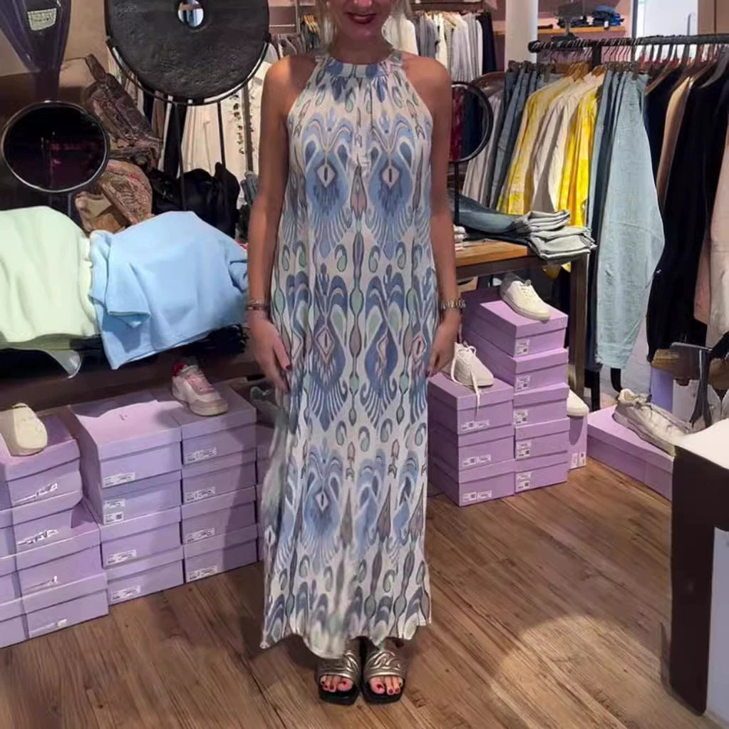 Women's flowing maxi dress with halter neck, ornamental ikat print and wide fall StylebySassy