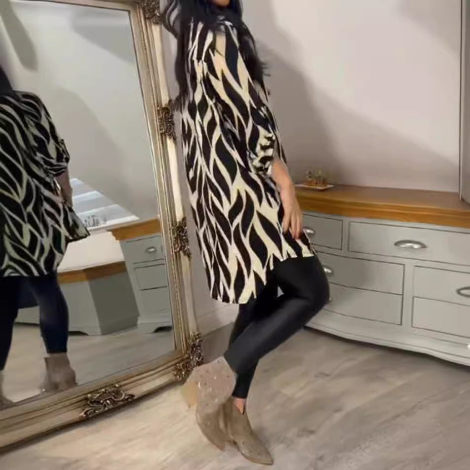 Women's oversized long tunic with abstract wave print, V-neckline and roll-up three-quarter sleeves StylebySassy