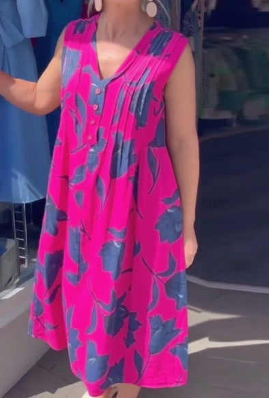 Women's sleeveless A-line midi dress with V-neck, bust pleats, button placket, and large floral print StylebySassy