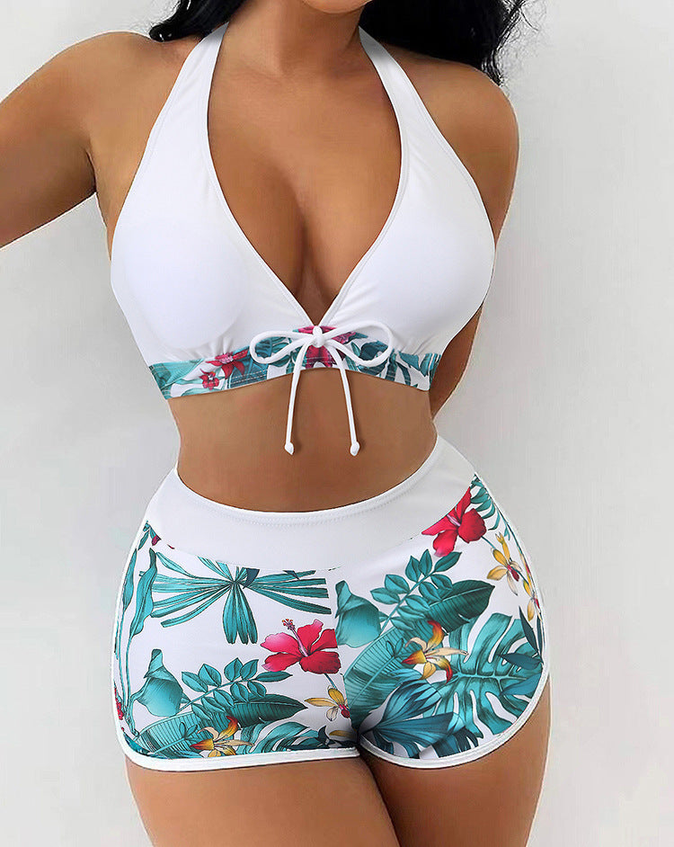 Women's bikini set with sporty high-waist cut and playful floral pattern StylebySassy
