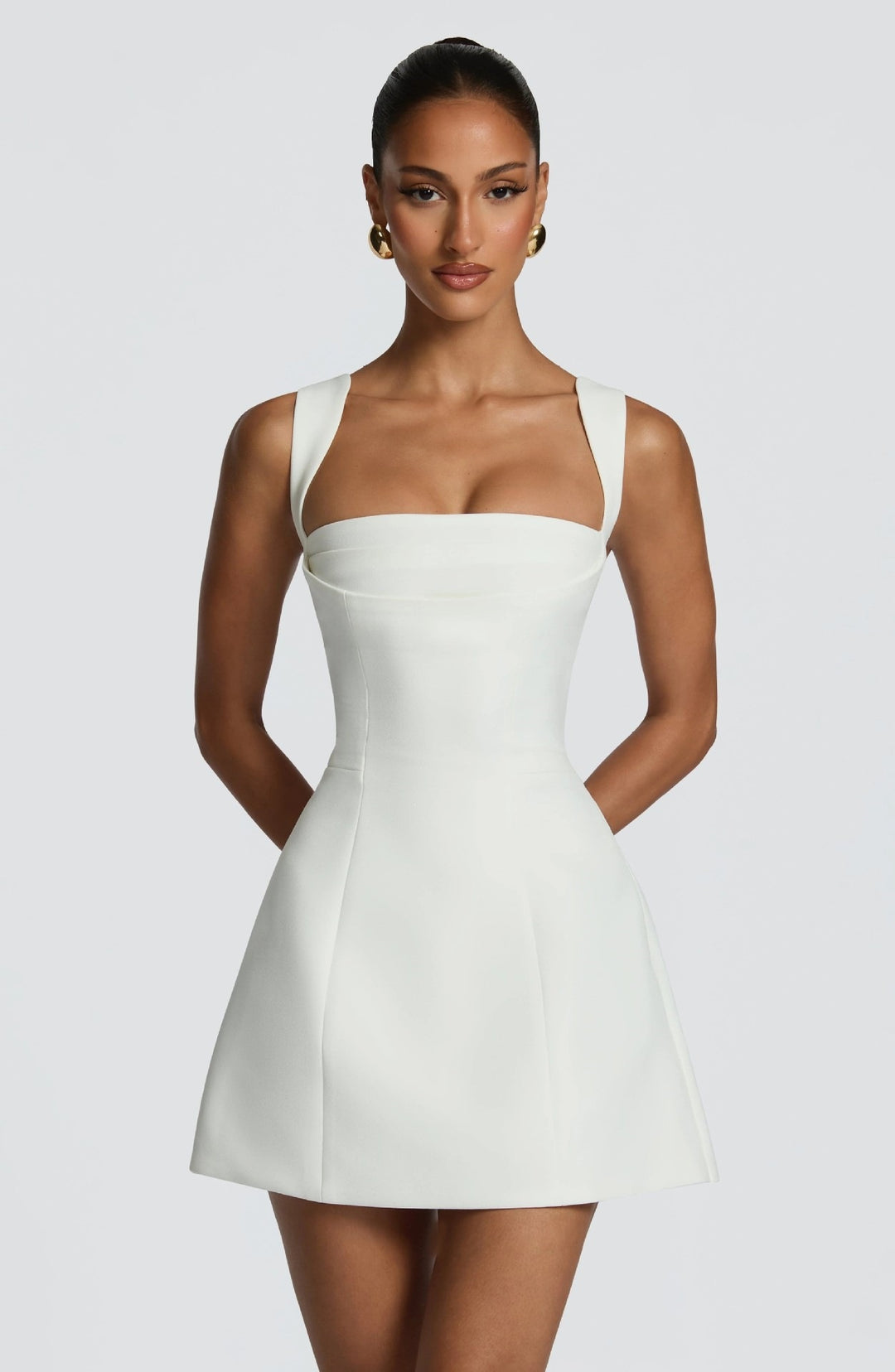 Women's fitted mini dress with wide straps and elegant neckline StylebySassy